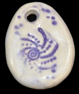 Handmade ceramic wolf-track bead